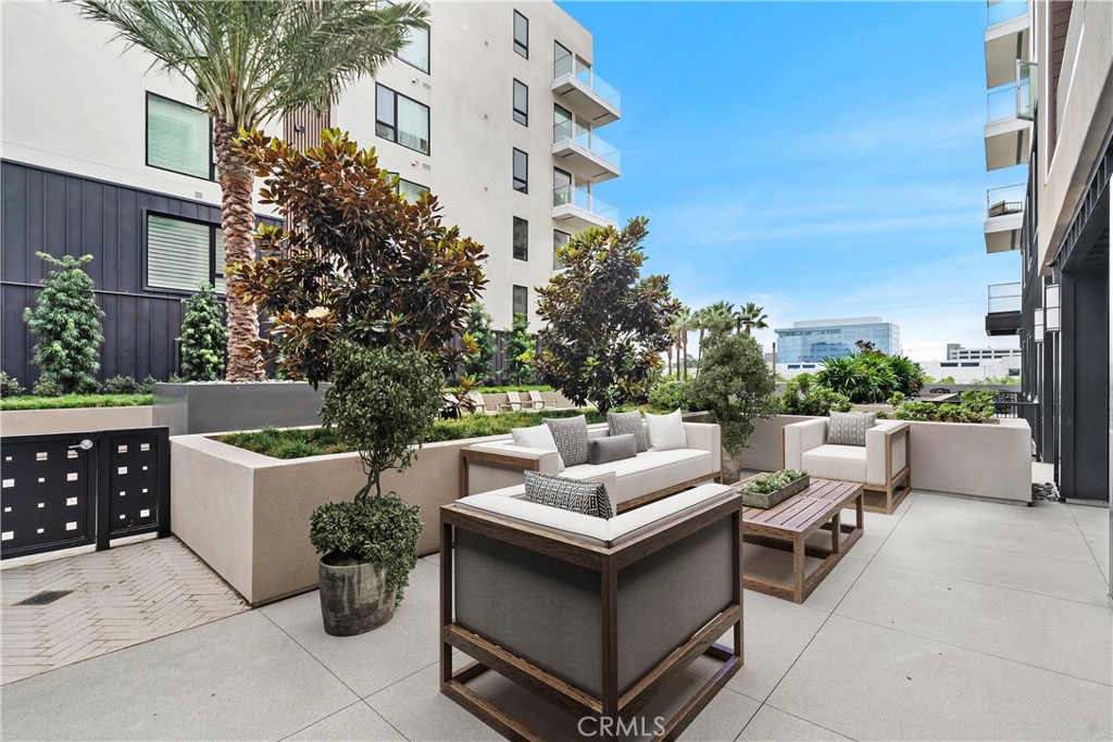 1202 Rivington Irvine, CA 92612 - Photo 22 of 52 a view of a patio with couches and potted plants