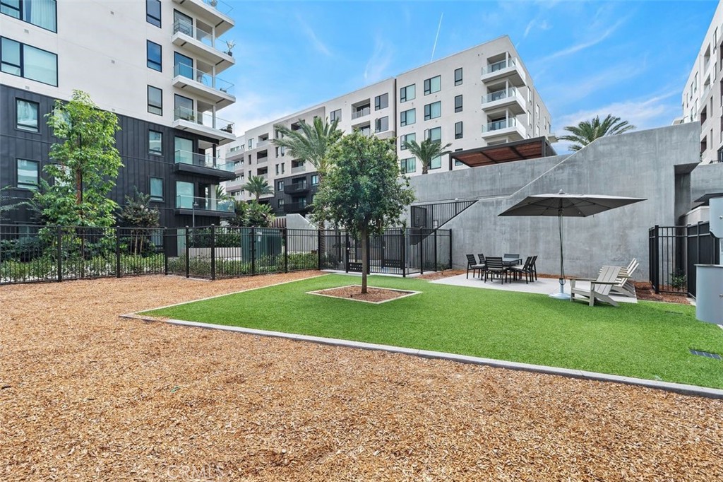 1202 Rivington Irvine, CA 92612 - Photo 33 of 52 a view of a big building with a big yard and large trees