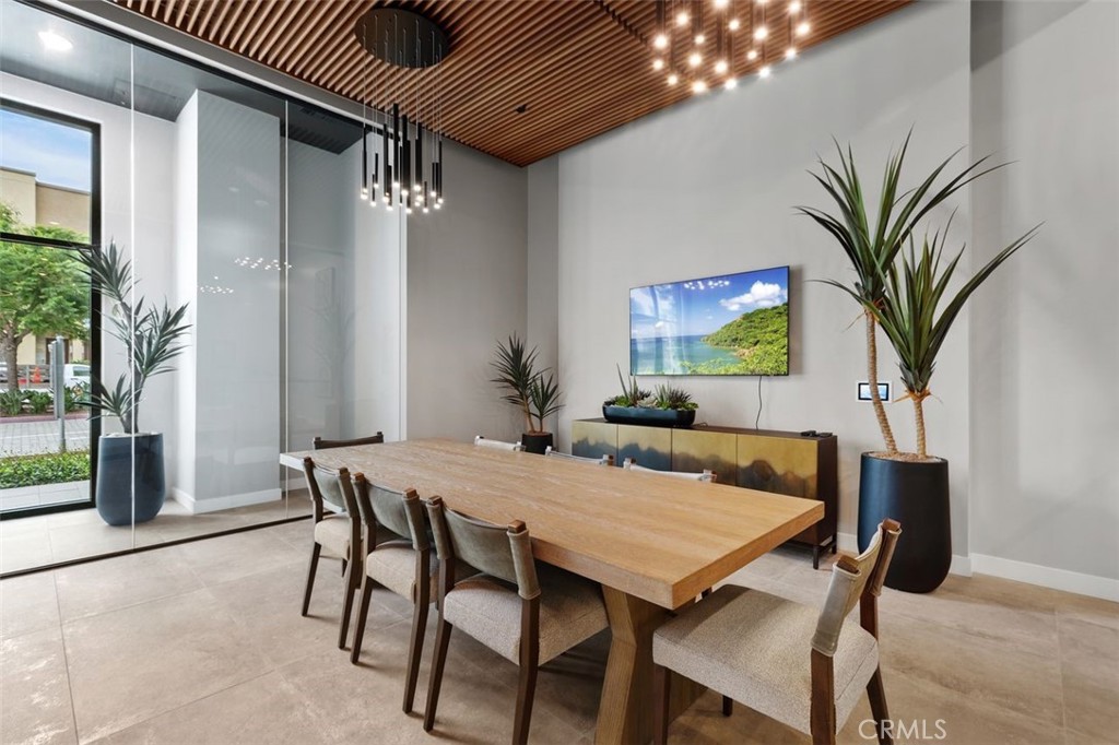 1202 Rivington Irvine, CA 92612 - Photo 36 of 52 a view of a dining room with furniture and a potted plant