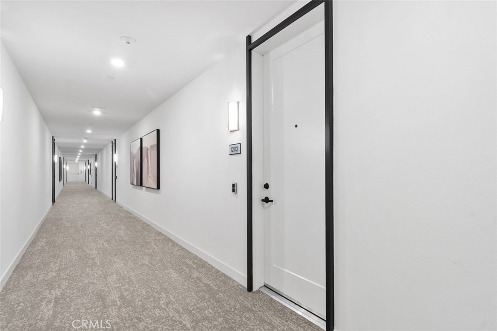 1202 Rivington Irvine, CA 92612 - Photo 6 of 52 a view of hallway with a large mirror