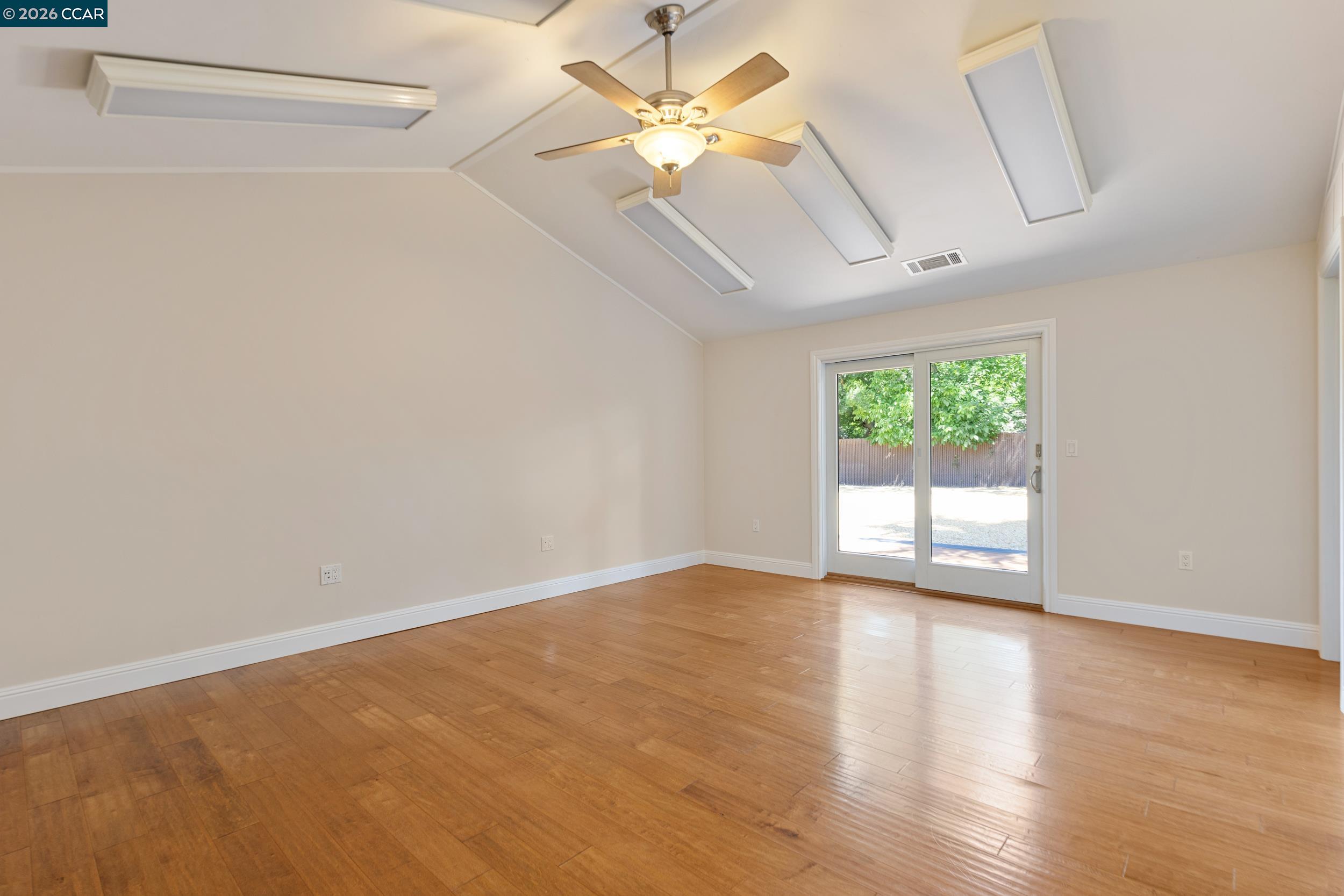 484 Diablo Road Danville, CA 94526 - Photo 37 of 39 an empty room with wooden floor and windows