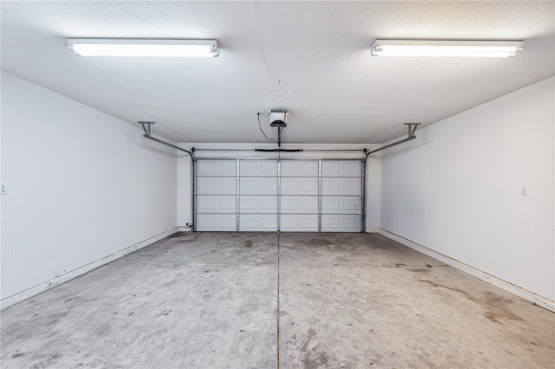 2524 South Ridge Avenue Bullhead City, AZ 86429 - Photo 48 of 64 Garage featuring a garage door opener