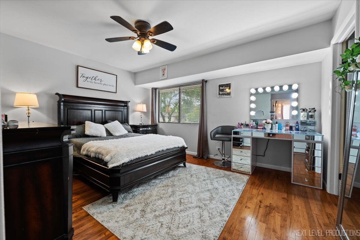 1094 Cascade Drive Aurora, IL 60506 - Photo 12 of 21 a bedroom with a bed and a view of kitchen