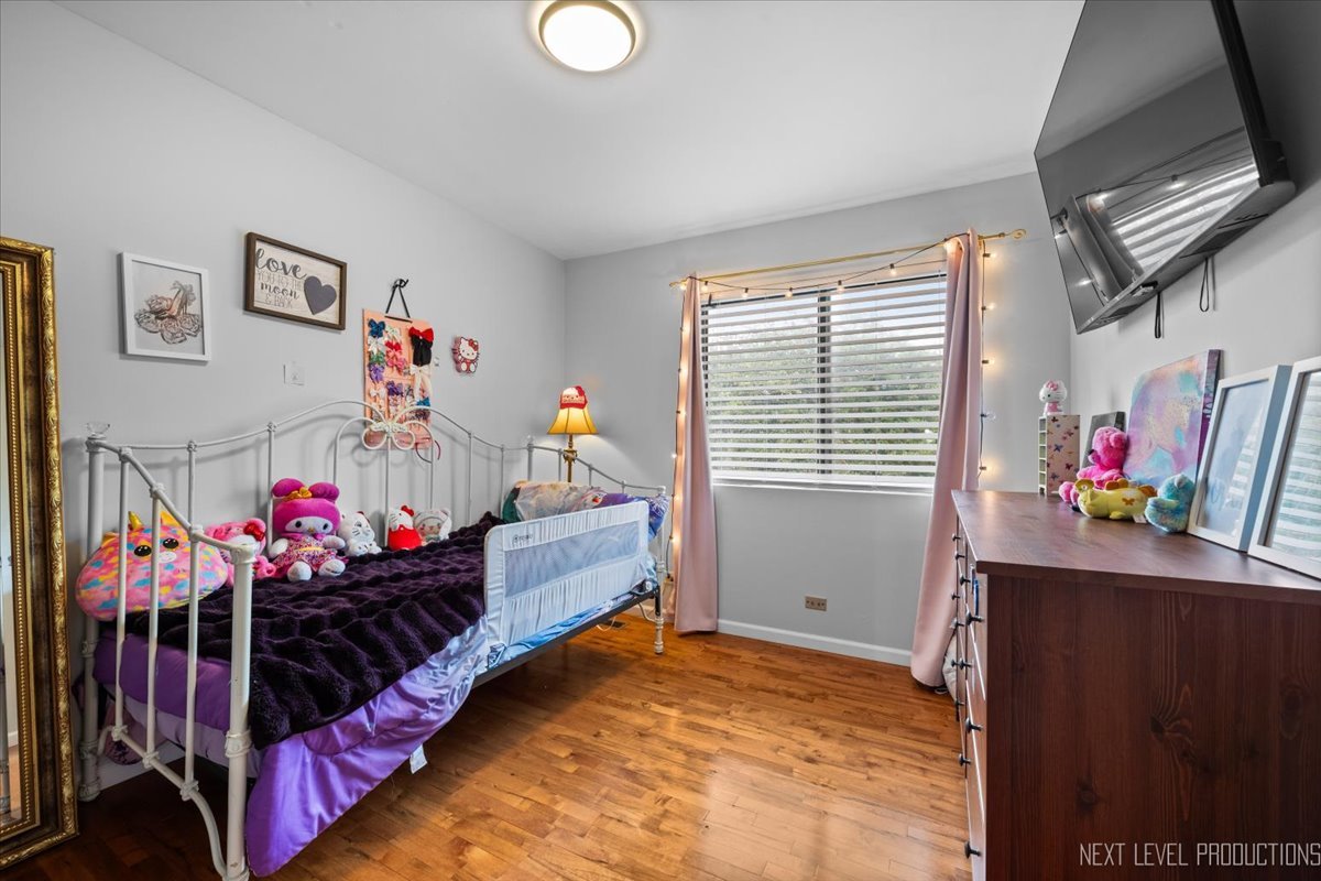 1094 Cascade Drive Aurora, IL 60506 - Photo 15 of 21 a bed room with a bed and a window