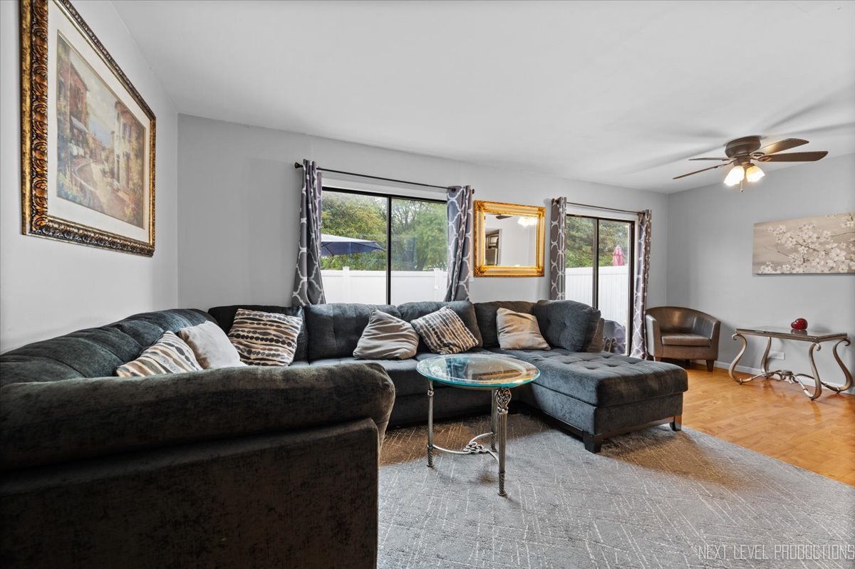 1094 Cascade Drive Aurora, IL 60506 - Photo 6 of 21 a living room with furniture and a large window