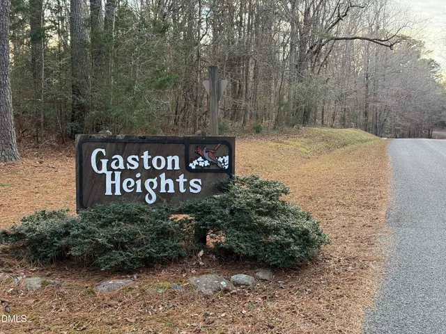 a view of sign board and green space