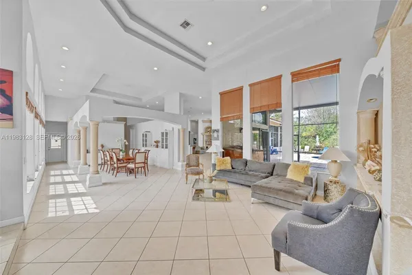 a living room with furniture and white walls