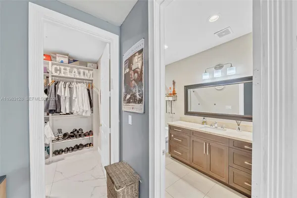 a bathroom with a sink a toilet and bathtub
