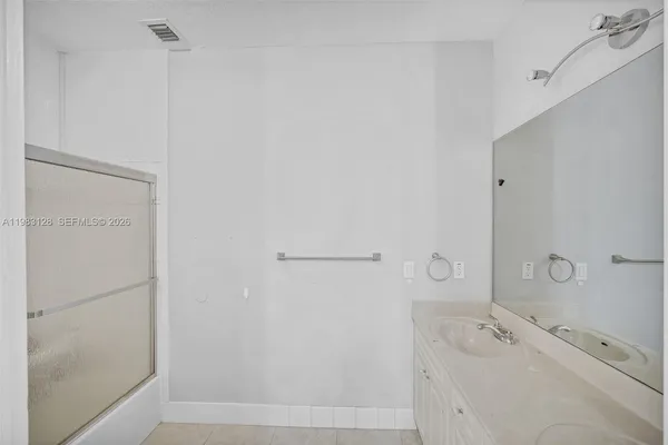 a view of a room with furniture and floor to ceiling window