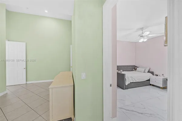 a bedroom with a bed and a shower