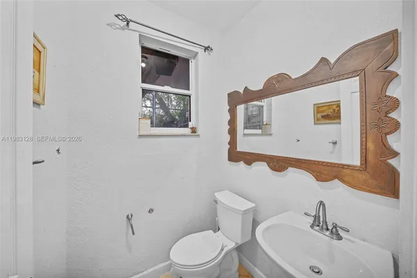 a view of a porch with wooden floor and fence