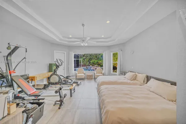 a view of a house with swimming pool and sitting area
