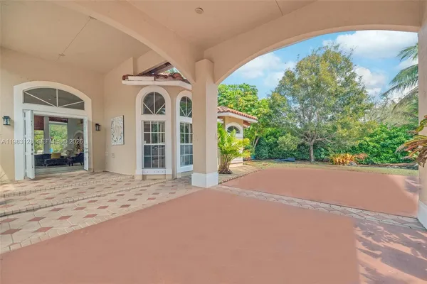 a kitchen with center island table and chairs
