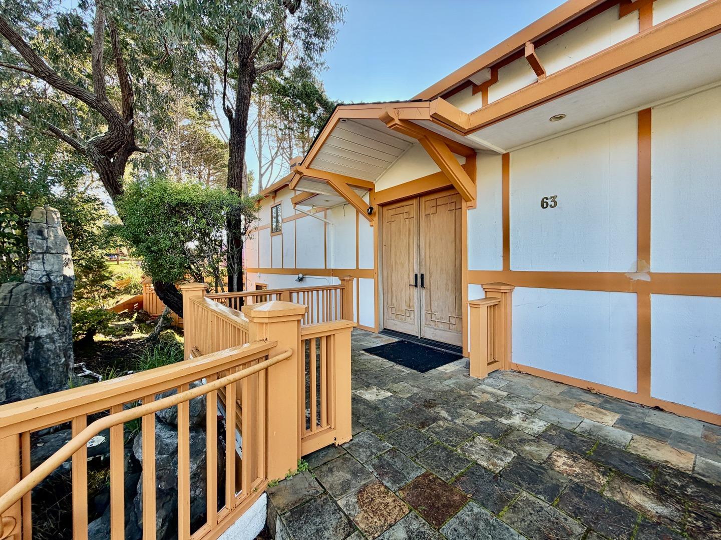 63 Berryessa Way Hillsborough, CA 94010 - Photo 3 of 39 a view of a small house with wooden fence