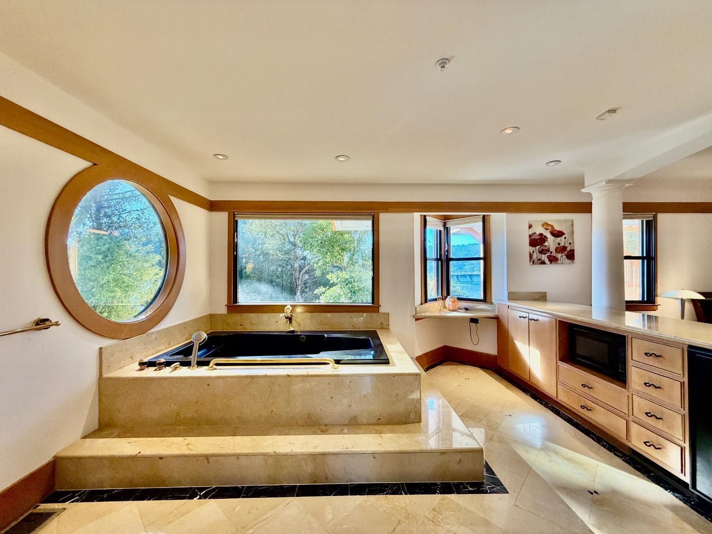 63 Berryessa Way Hillsborough, CA 94010 - Photo 34 of 39 a living room with large window and a couch