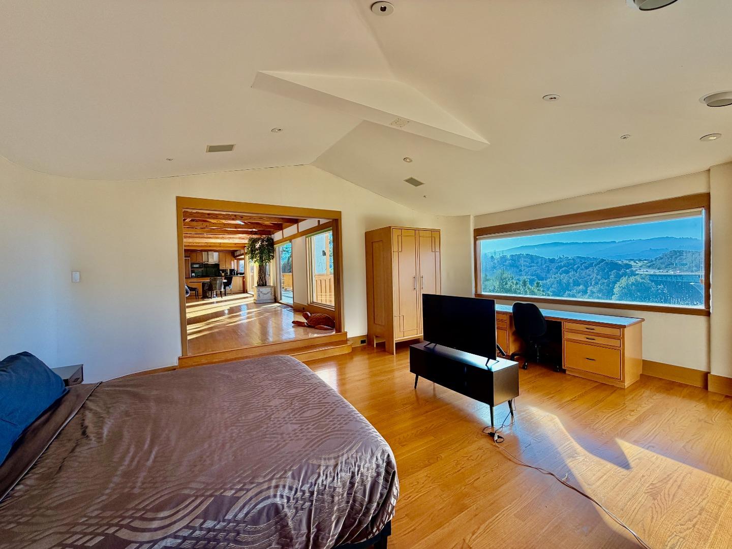 63 Berryessa Way Hillsborough, CA 94010 - Photo 10 of 39 a bedroom with a bed and wooden floor