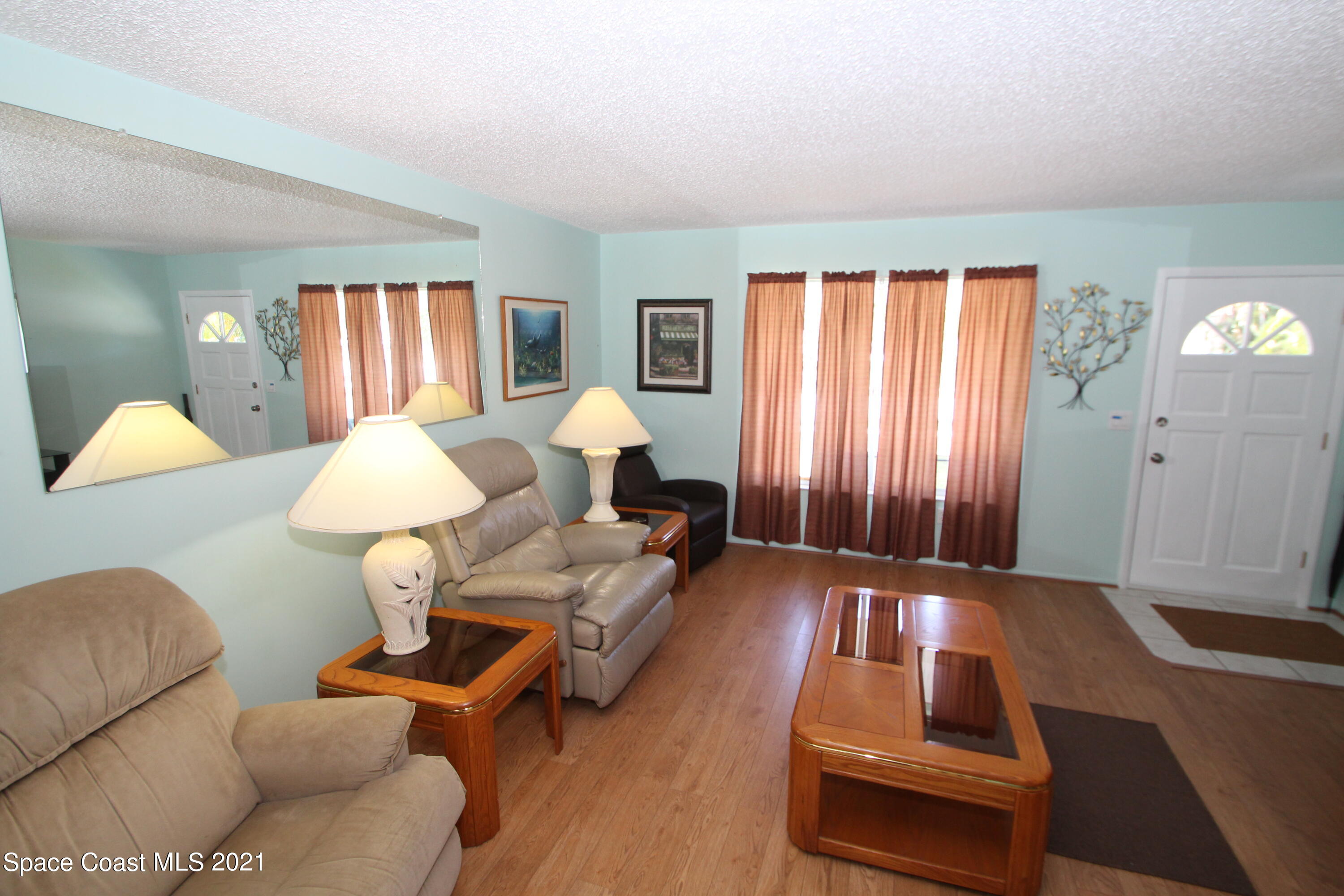 1398 Creel Road Northeast Palm Bay, FL 32905 - Photo 13 of 37 a living room with furniture