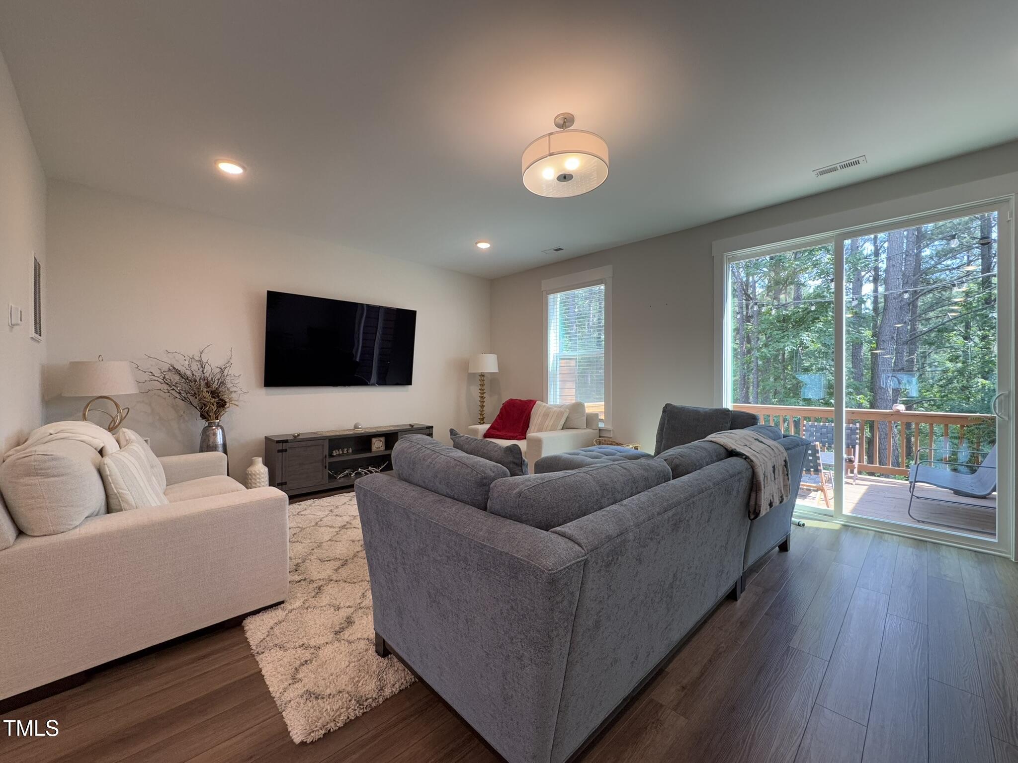 1244 Corkery Ridge Court Cary, NC 27519 - Photo 12 of 37 a living room with furniture and a flat screen tv