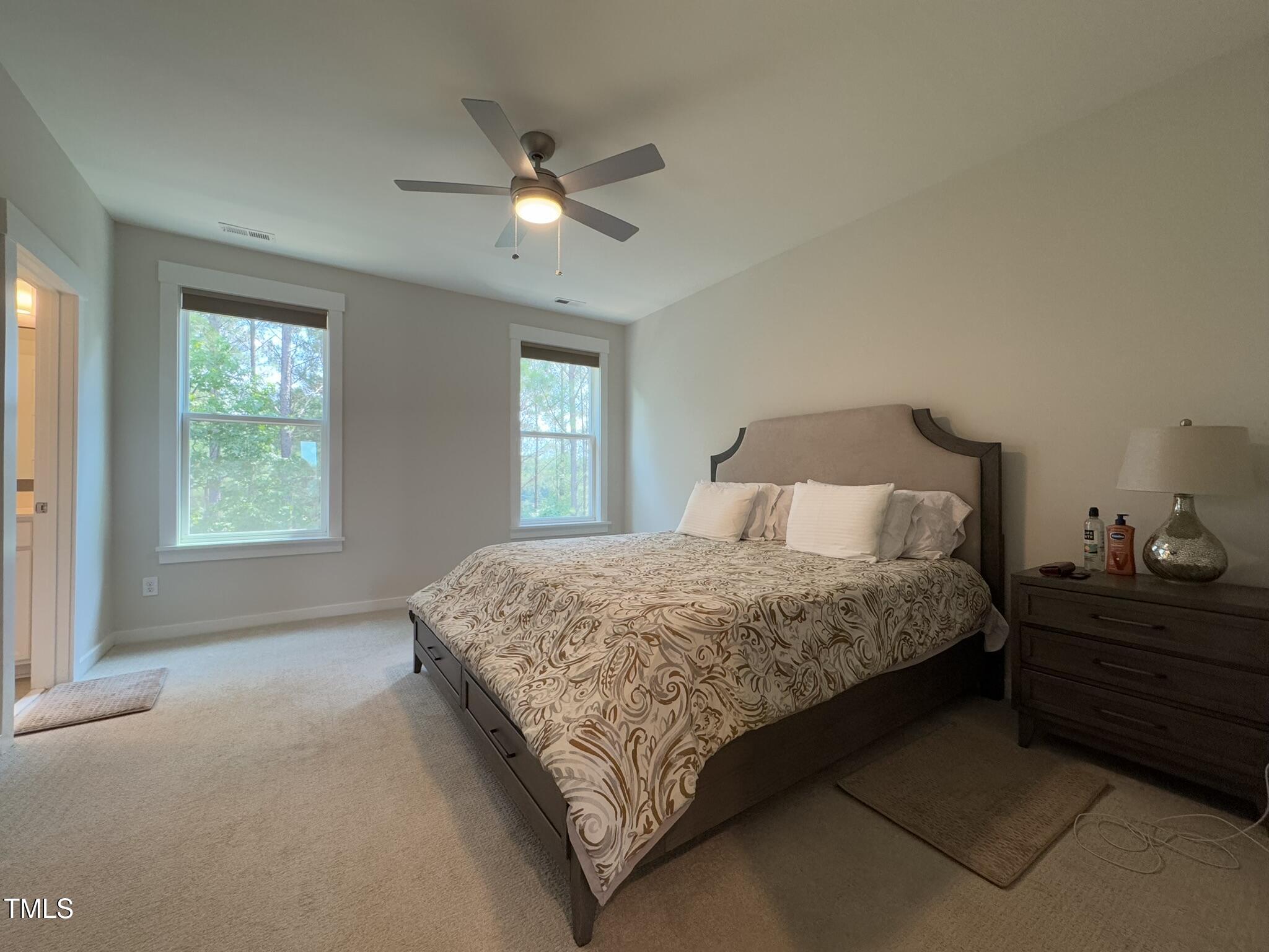 1244 Corkery Ridge Court Cary, NC 27519 - Photo 16 of 37 a bedroom with a bed and window