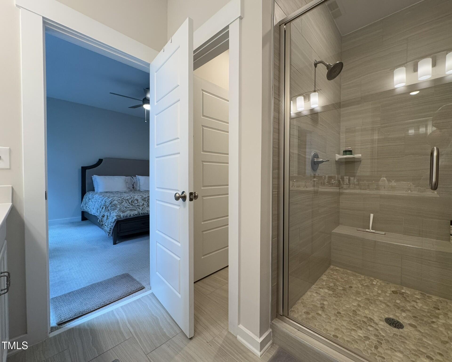 1244 Corkery Ridge Court Cary, NC 27519 - Photo 20 of 37 a bathroom with a glass shower door