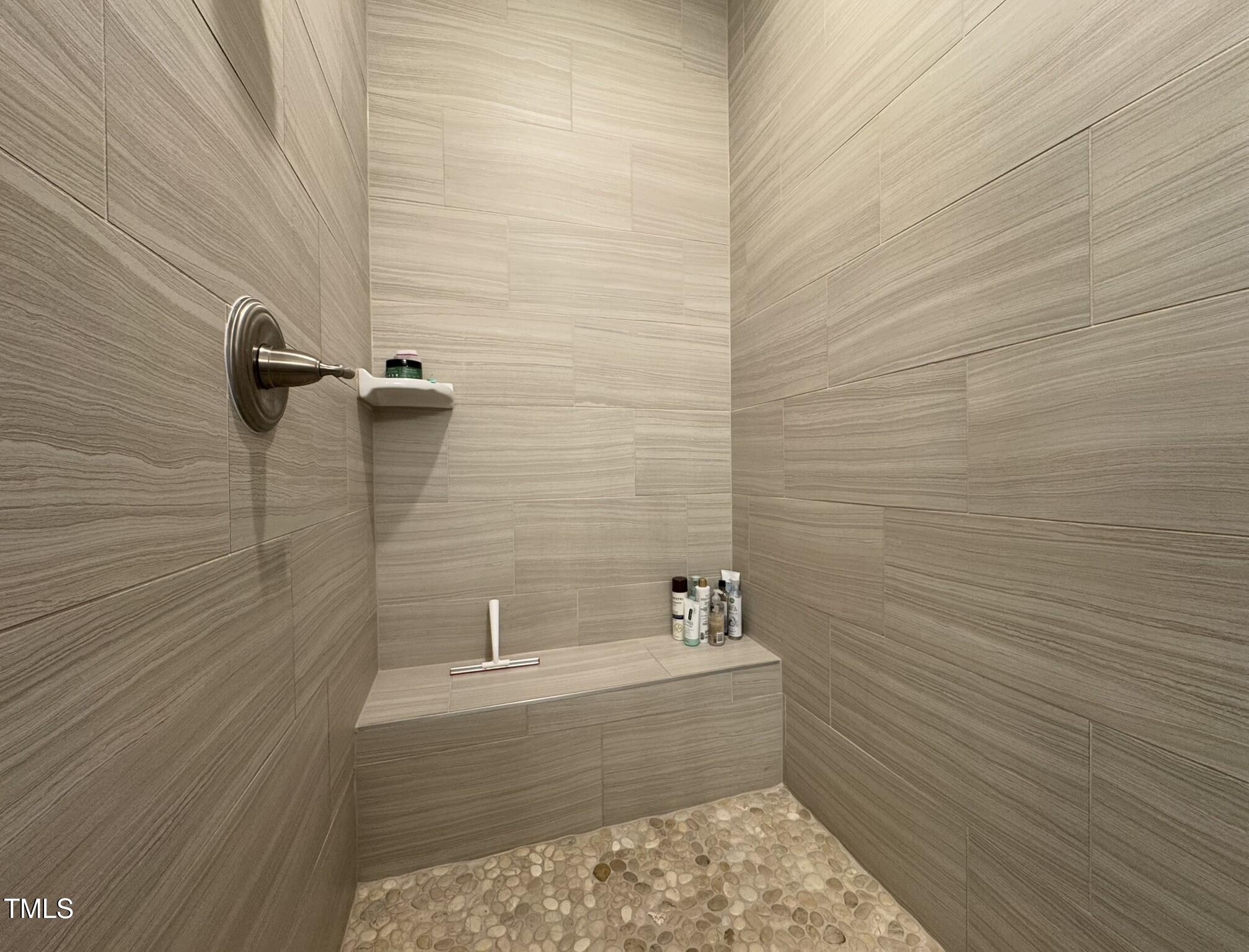 1244 Corkery Ridge Court Cary, NC 27519 - Photo 21 of 37 a bathroom with a bathtub and shower