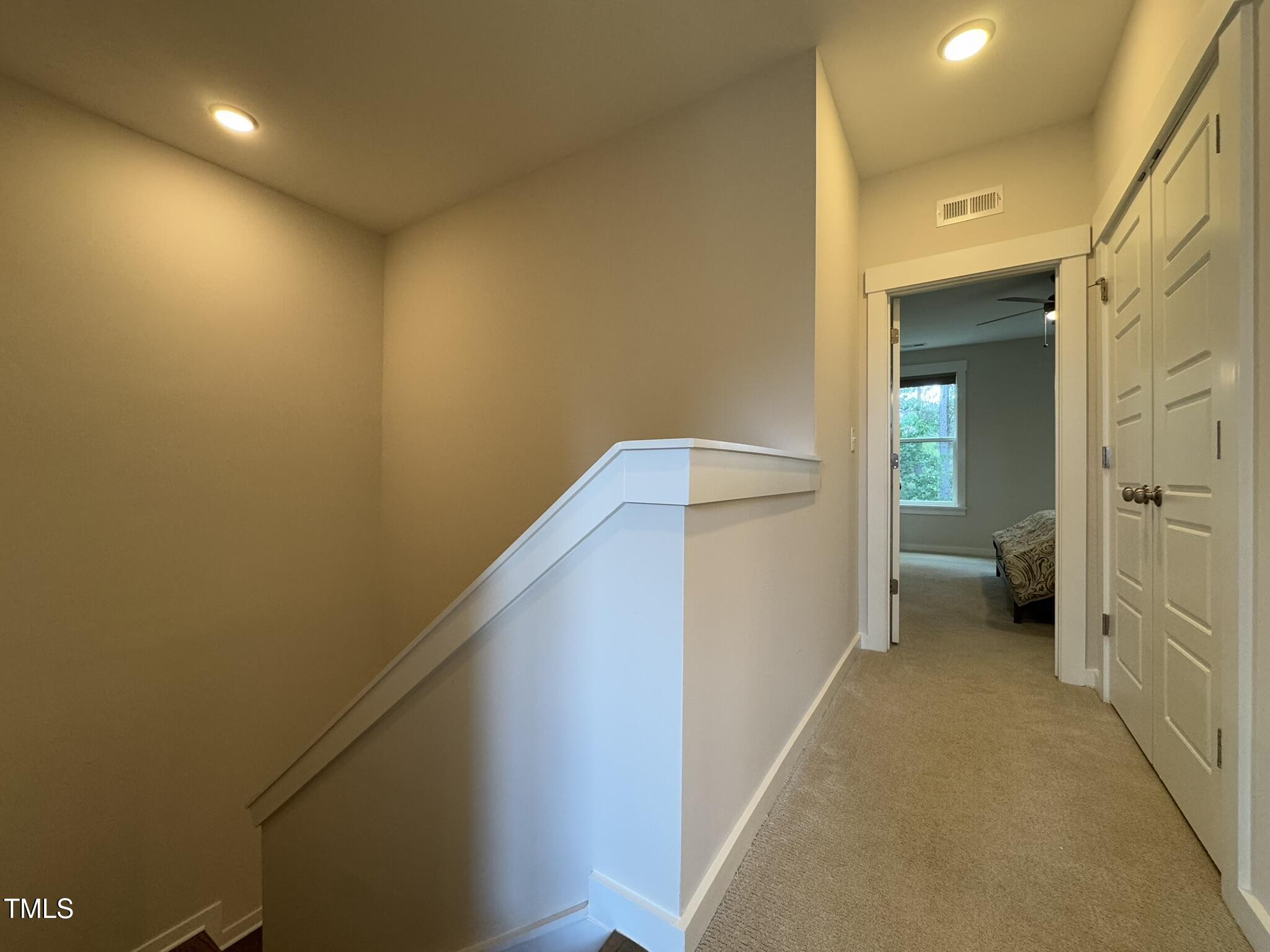 1244 Corkery Ridge Court Cary, NC 27519 - Photo 24 of 37 a view of a hallway with a livingroom