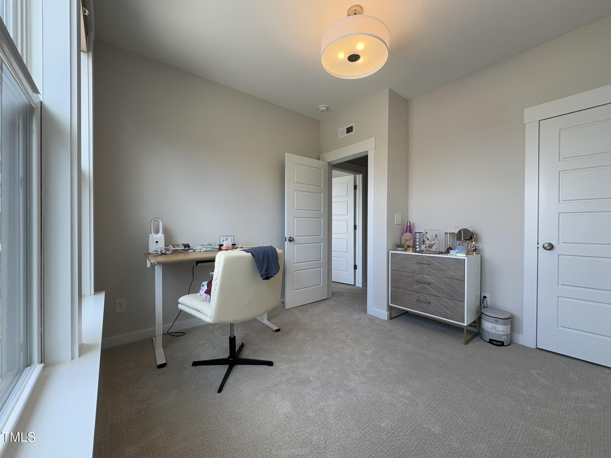 1244 Corkery Ridge Court Cary, NC 27519 - Photo 28 of 37 a view of a workspace with furniture and a window