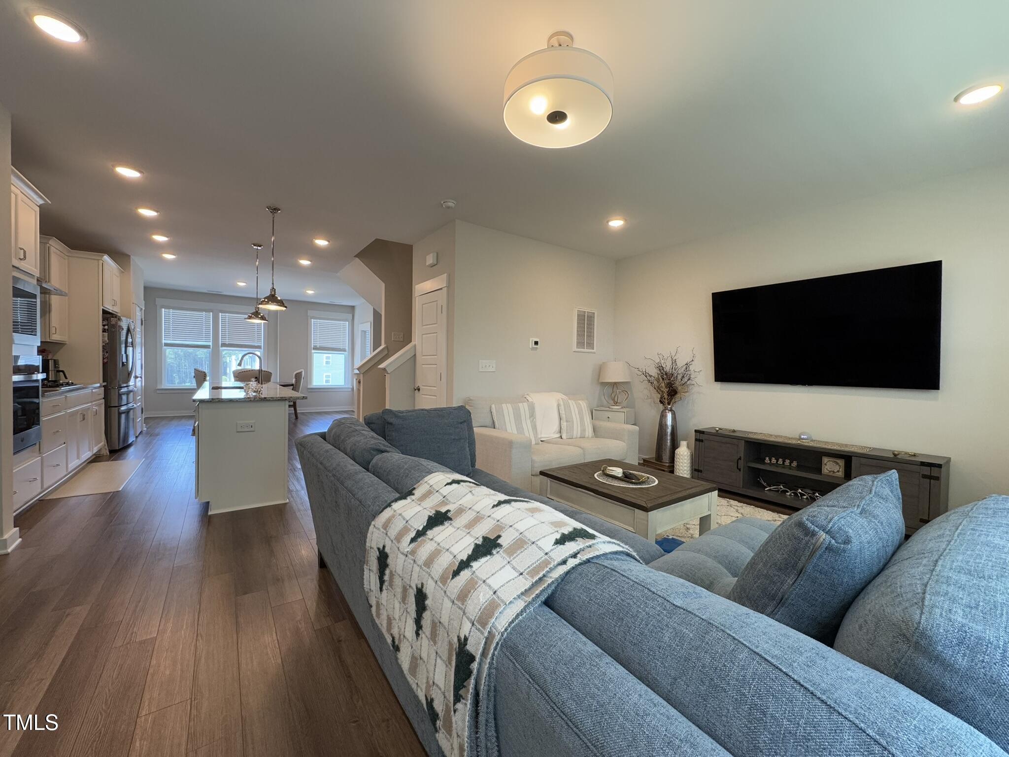 1244 Corkery Ridge Court Cary, NC 27519 - Photo 3 of 37 a living room with furniture and a flat screen tv