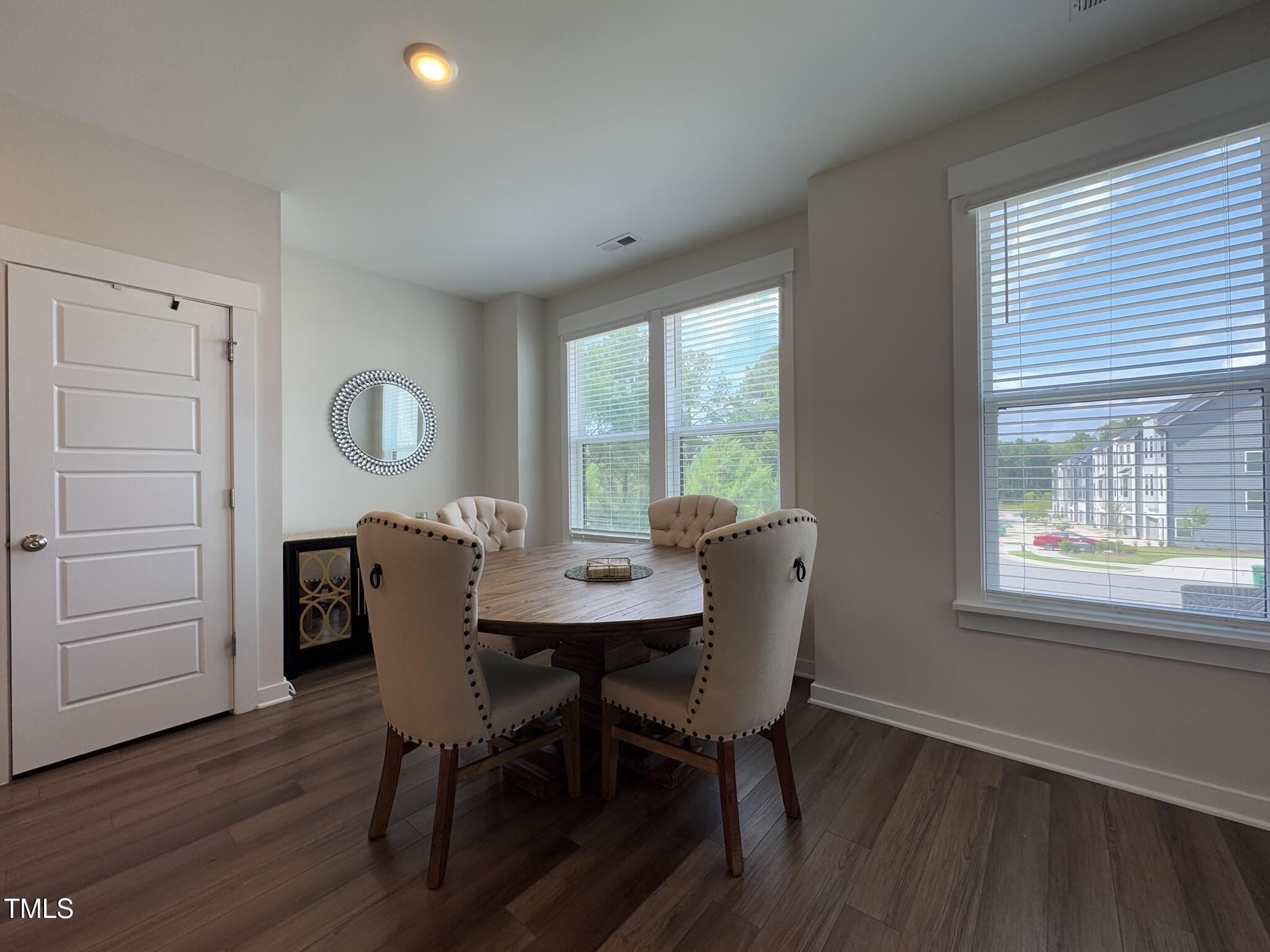 1244 Corkery Ridge Court Cary, NC 27519 - Photo 10 of 37 a view of a dining room with furniture and a window