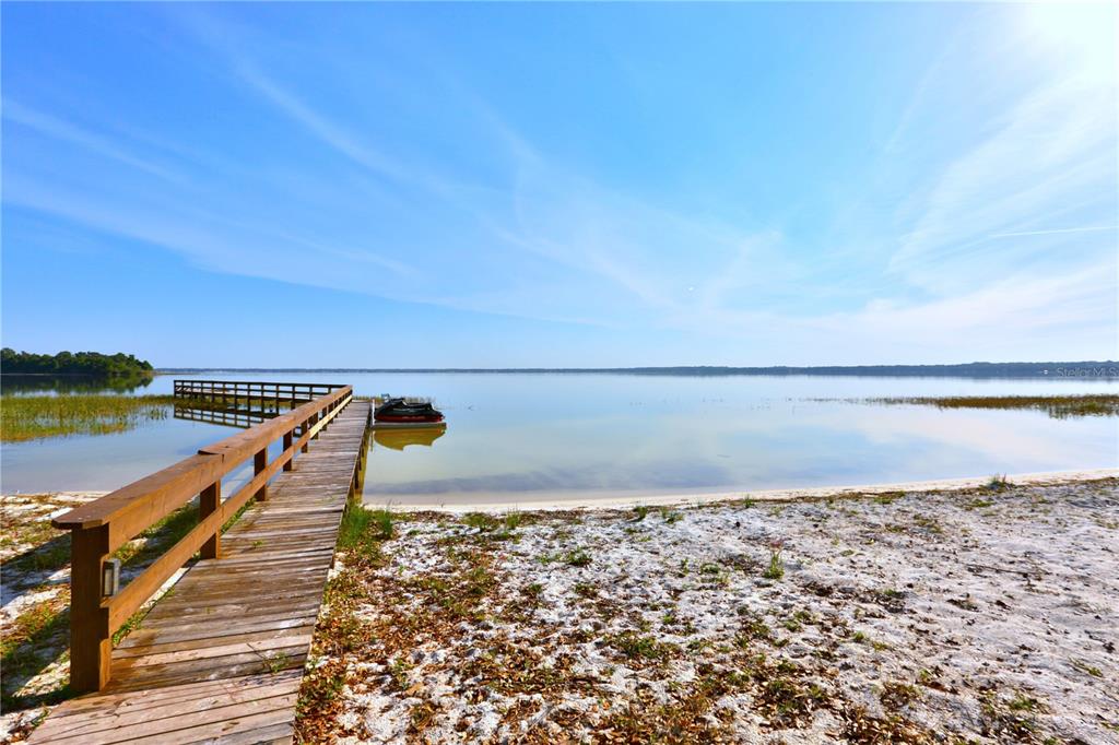 12115 Southeast Sunset Harbor Road Weirsdale, FL 32195 - Photo 18 of 35 a view of a lake and outdoor space