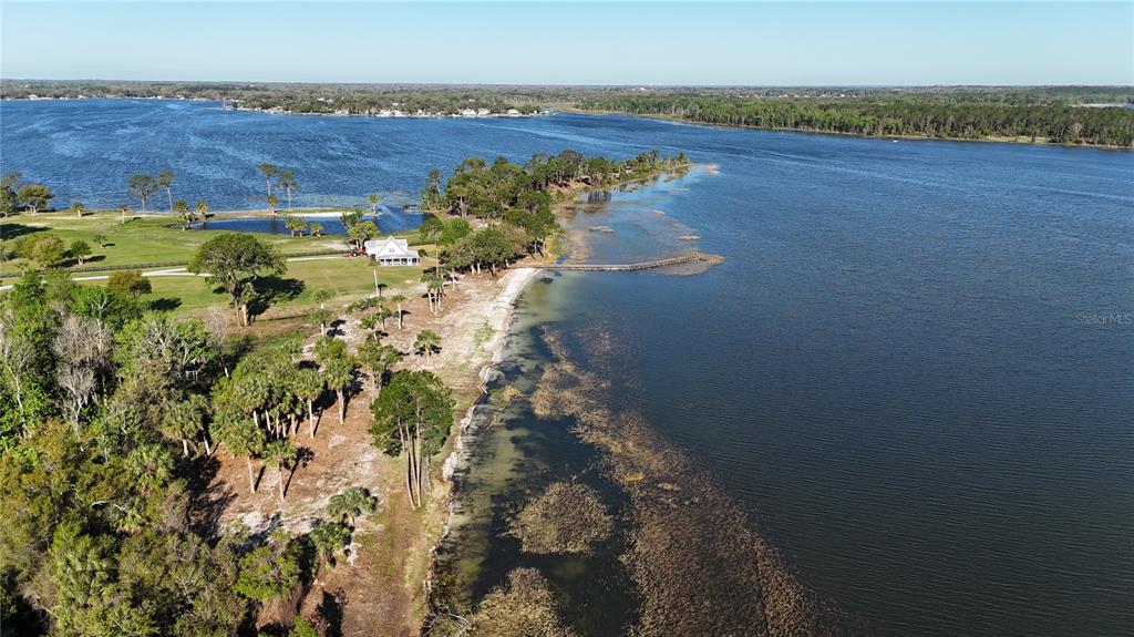12115 Southeast Sunset Harbor Road Weirsdale, FL 32195 - Photo 5 of 35 a view of a lake