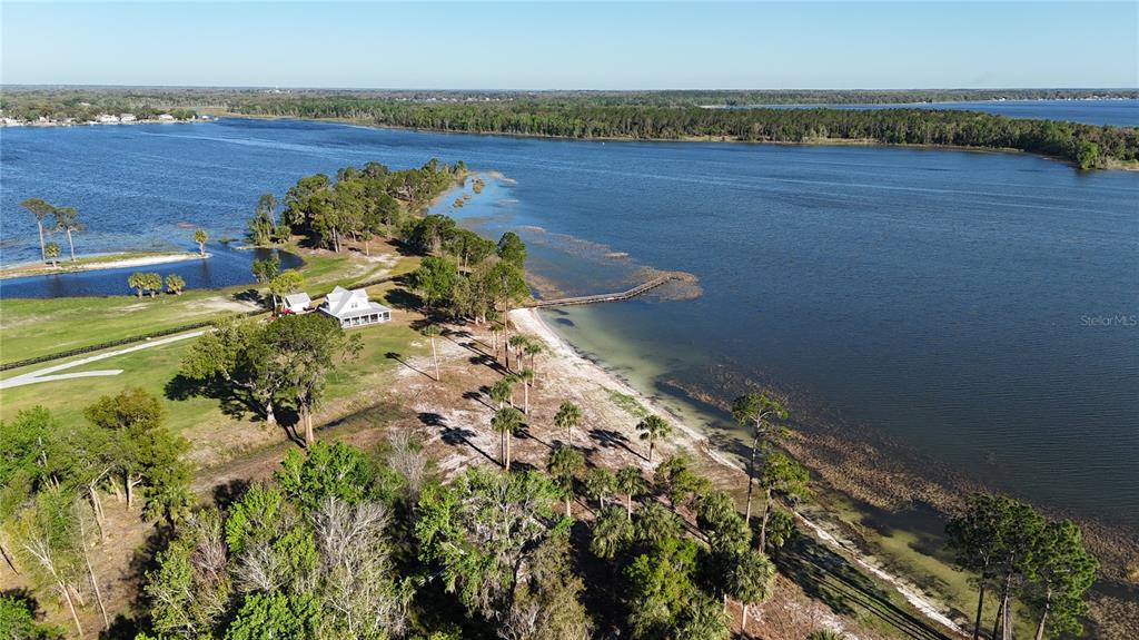 12115 Southeast Sunset Harbor Road Weirsdale, FL 32195 - Photo 7 of 35 a view of a lake with a lake