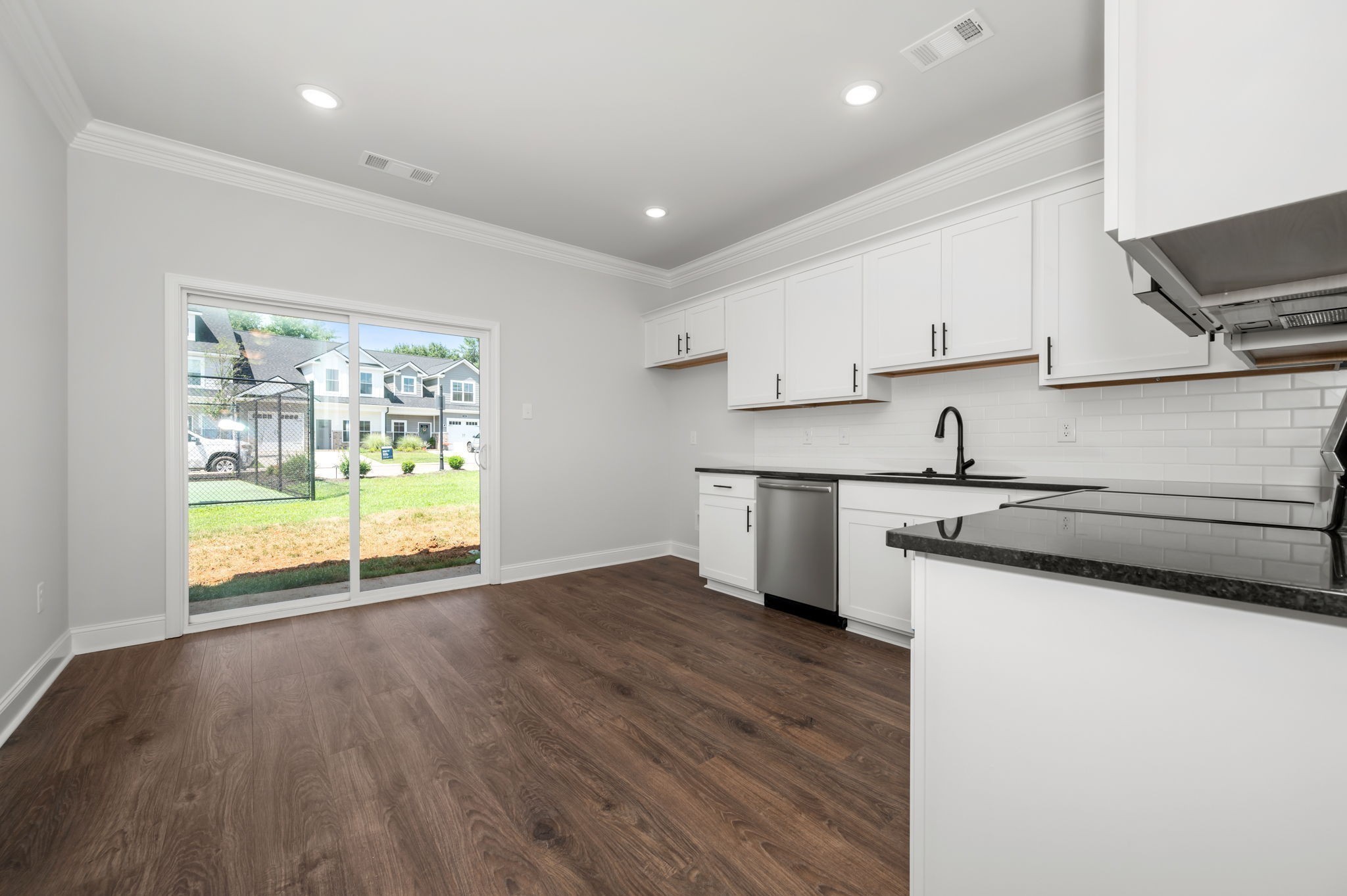512 Rohan Drive Murfreesboro, TN 37129 - Photo 6 of 32 a kitchen with stainless steel appliances granite countertop a sink and a stove top oven