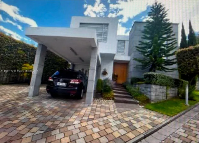 a car parked in front of a house