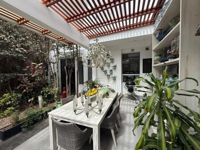 a outdoor dining space with furniture