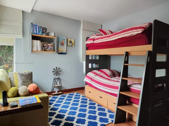 a bathroom with a sink a toilet and a shower