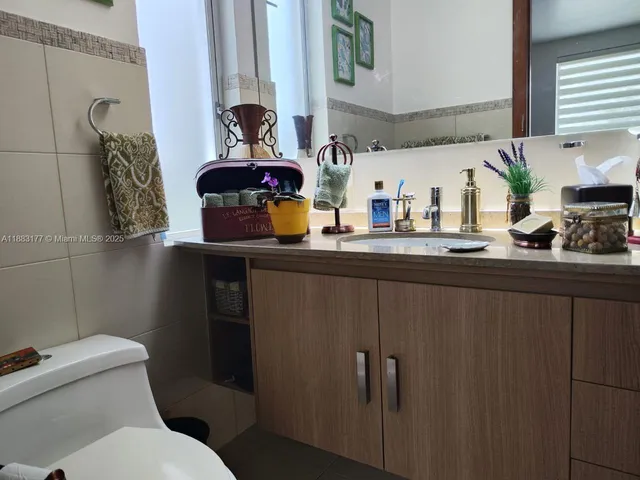 a living room with furniture fireplace and flat screen tv