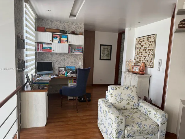 a view of a room with rack on the wall and a window