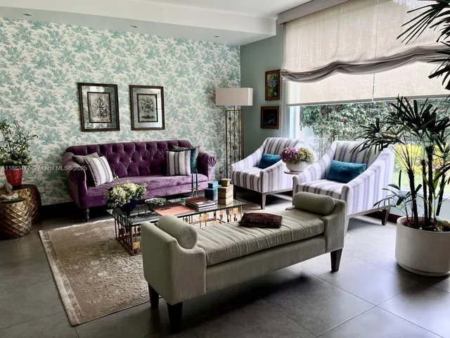 a living room with furniture and a lamp