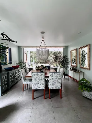 a view of a dining room with furniture and a livingroom