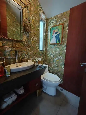 a bathroom with a sink and a toilet