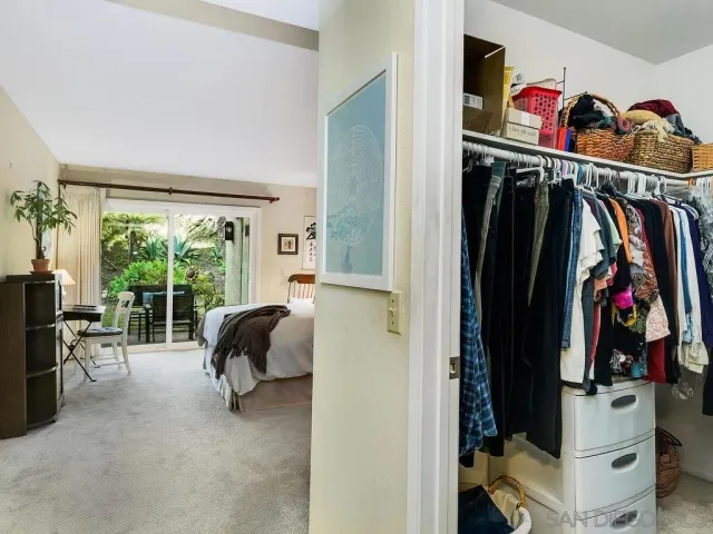 a bed room with a bed and a window