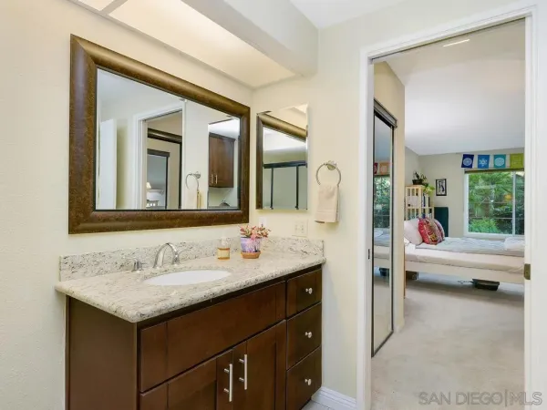 a bathroom with a sink and a mirror