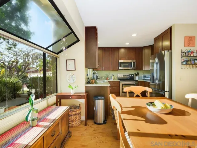 a kitchen with a sink stove and refrigerator