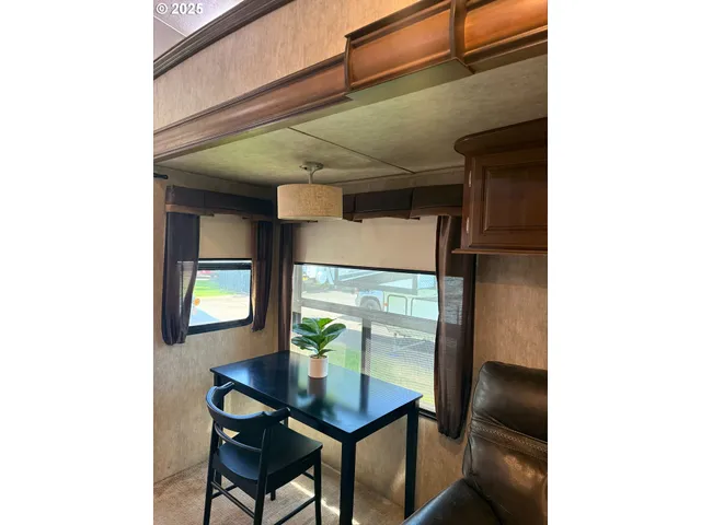 a view of a hallway with seating area