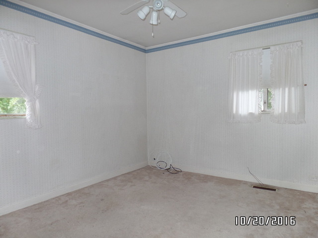 276 Rich Road Park Forest, IL 60466 - Photo 12 of 18 an empty room with a window and a ceiling fan