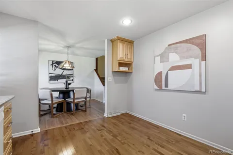 a view of a livingroom with furniture and wooden floor