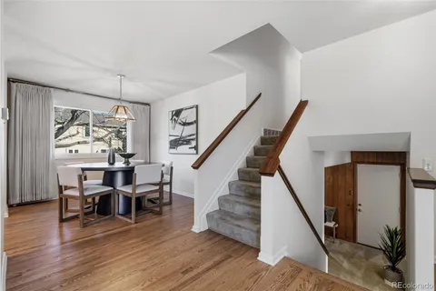 a view of a livingroom with furniture and wooden floor