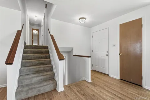 a view of entryway with wooden floor