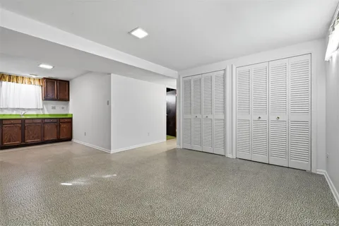 a kitchen with stainless steel appliances a sink and cabinets